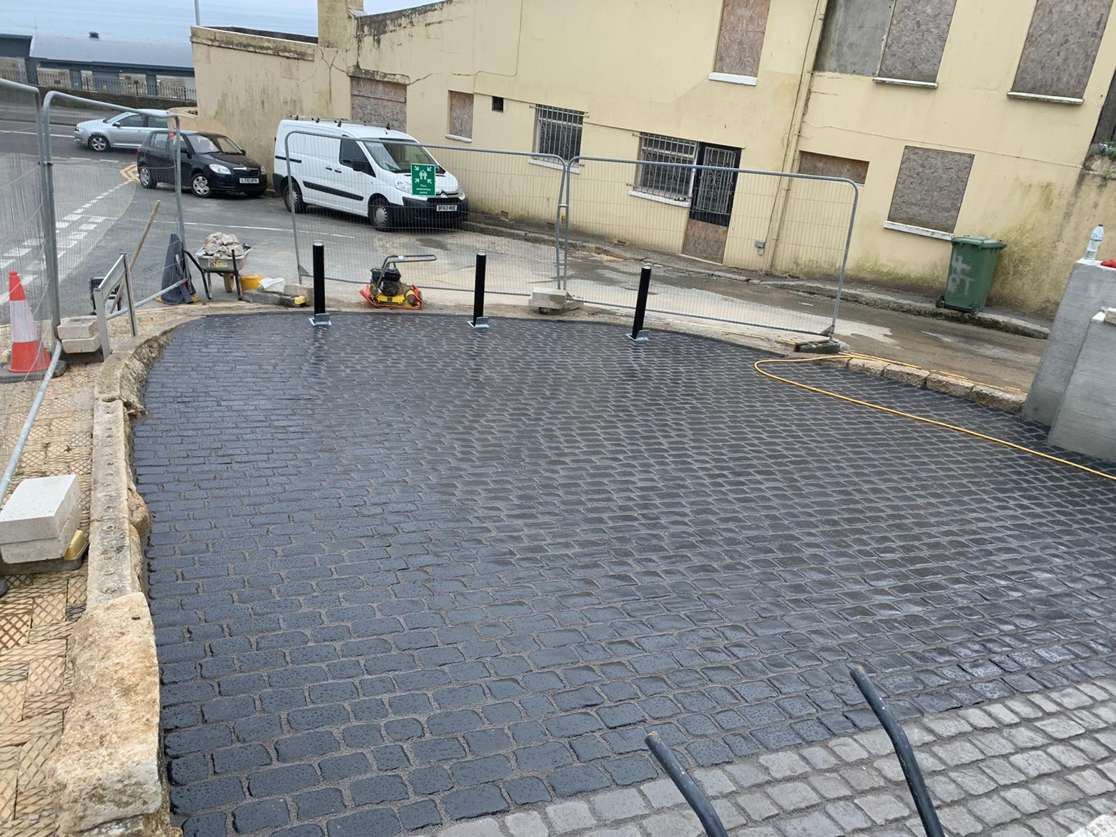 Completed Marshalls cobbled driveway with granite kerbing and security bollards on Lannoweth Road in Penzance, Cornwall