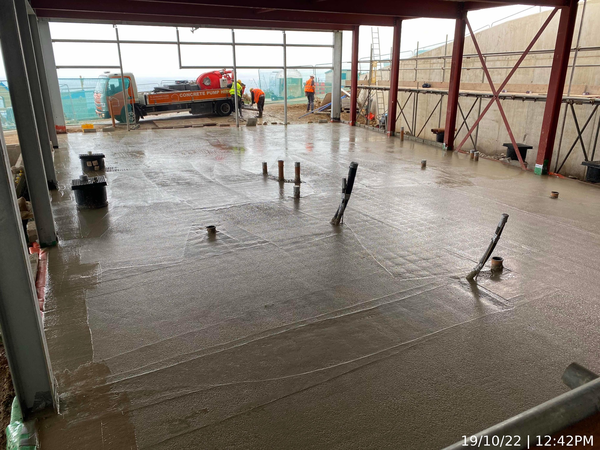 Power-floated reinforced concrete slab pour with drainage stubs at AYR Holiday Park